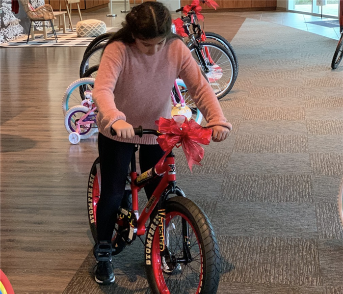 Girl on bike.