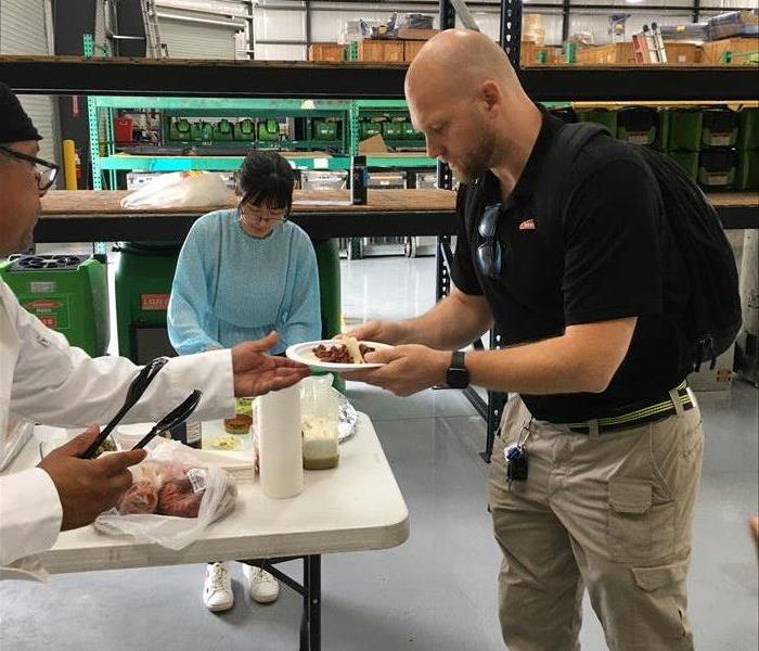 Team members grabbing tacos.