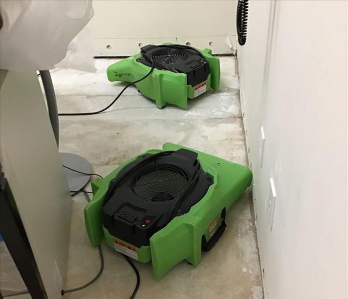 Two air movers on floor.