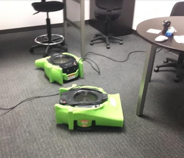 Drying equipment set up in an office space.