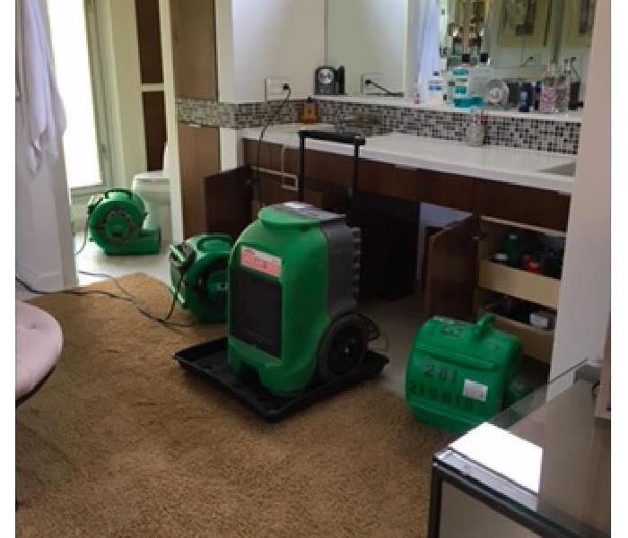 Drying equipment set up in bathroom.